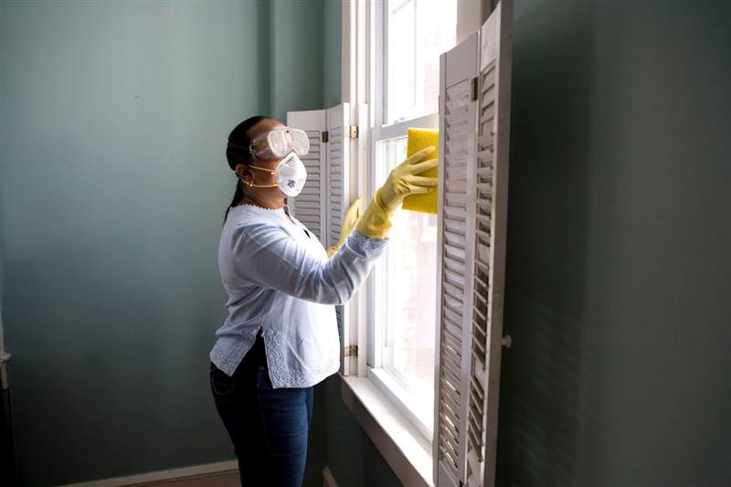 Cleaner wiping a sunlit surface